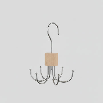 360 rotating storage hanger hook with a hand holding it above a belt